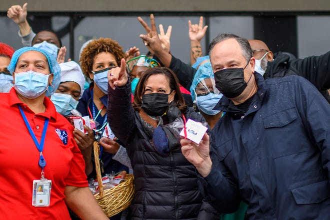 Vice President Kamala Harris, center, and her husband, Second Gentleman Doug Emhoff, pose for a picture with healthcare workers at the Washington, DC, VA Center, a veterans hospital, as they delivered baskets of Valentine's cookies on Feb. 13, 2021.